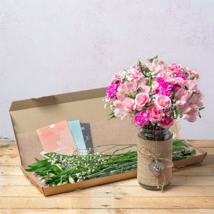 A beautiful collection of pink Spray Carnations and Alstroemeria with white Gypsophila.  Our letterbox flower gifts are delivered in specially designed letterbox friendly packaging and protected by fully compostable brown paper wrap